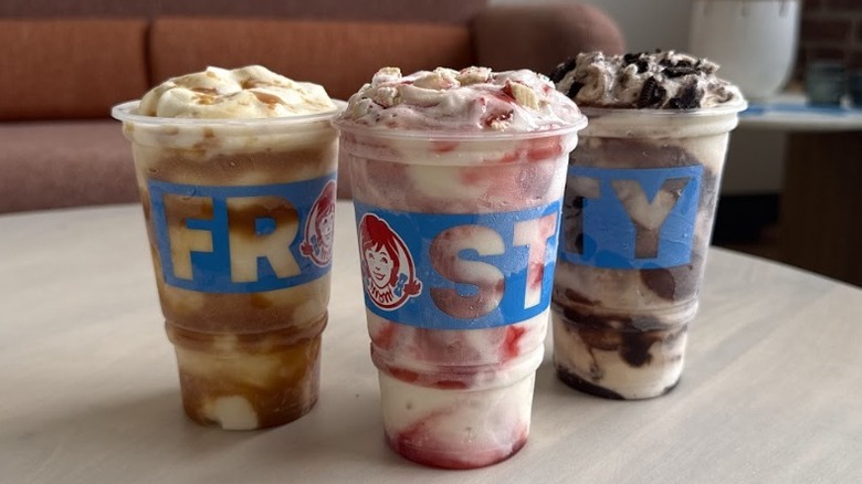 three Wendy's Frostys with mix ins