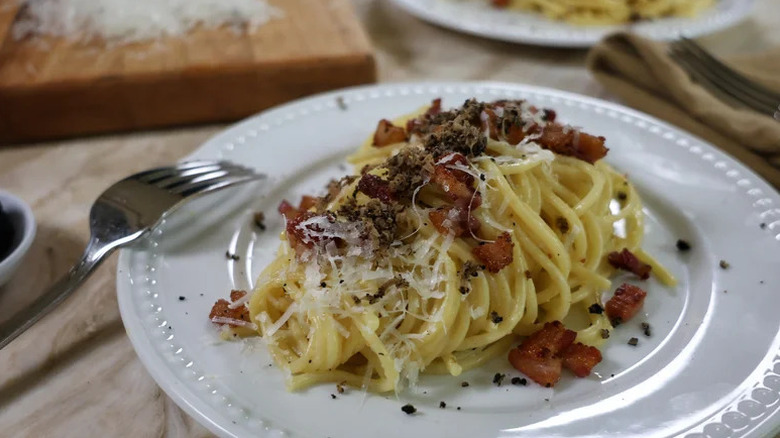 plate of black truffle pasta carbonara