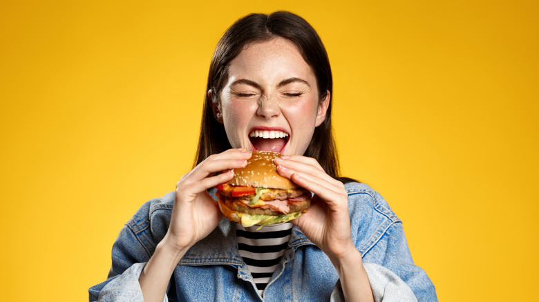 Woman eating a burger