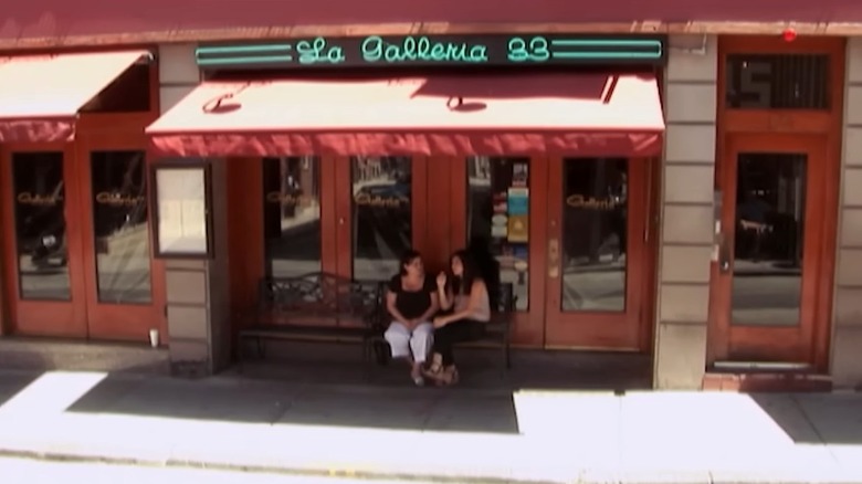 Two women sits in front of La Galleria 33 restaurant, as shown on Kitchen Nightmares