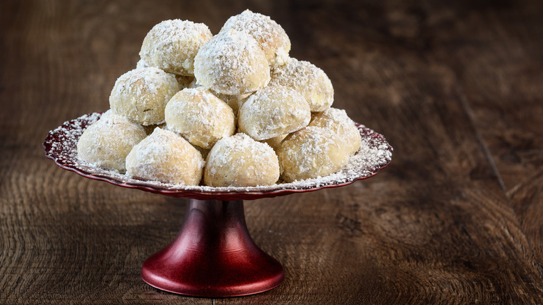 stack of snowball cookies on plate