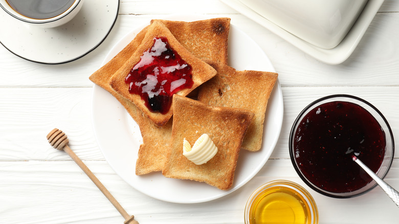 Plate of toast with butter and jam