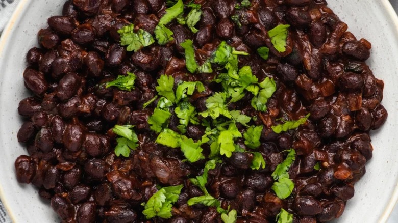 Black beans with cilantro wood bowl