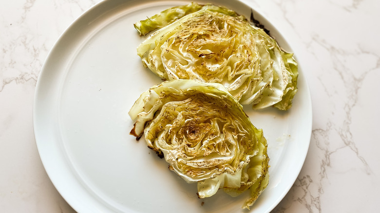 sliced cabbage on white plate