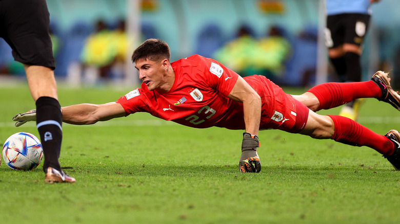 Uruguayan player diving to make save during 2022 World Cup