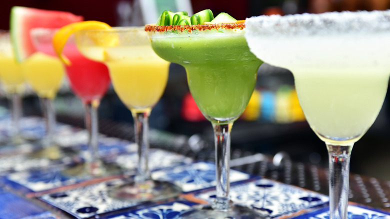 colorful flavored margaritas in glasses