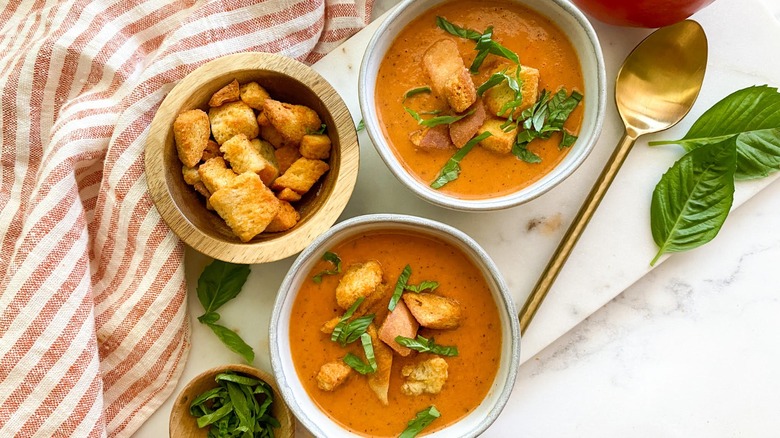 creamy tomato bisque in bowls