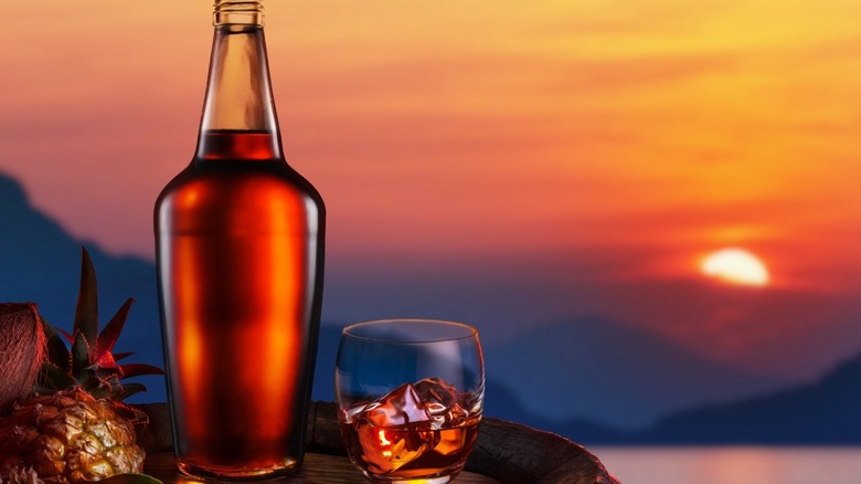 Rum bottle and sunset