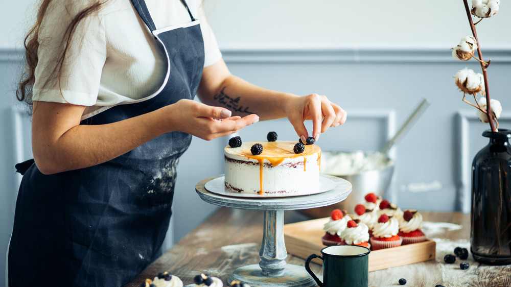 Chef decorating a cake