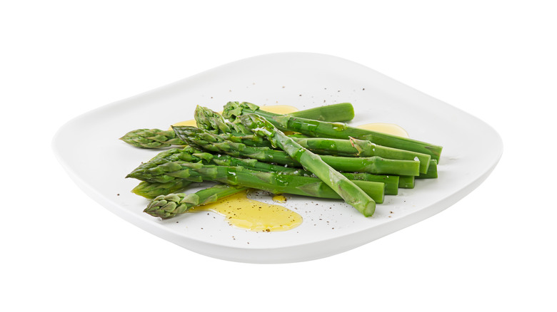 asparagus with butter on plate