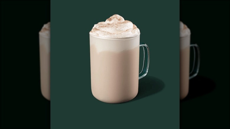 hot beverage with whipped cream and cinnamon on top 