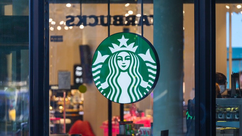 Starbucks logo hanging in window