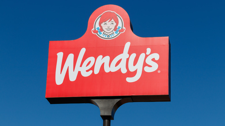 Red Wendy's sign on blue sky