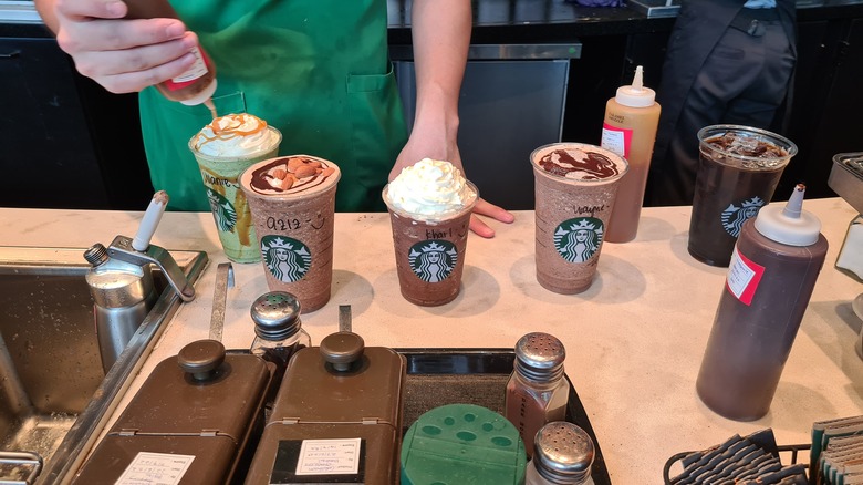 Barista prepares beverages