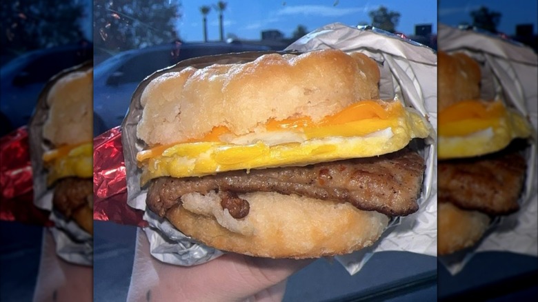 hand holding Wendy's breakfast biscuit