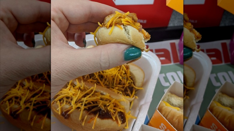 hand holding Krystal chili cheese pups