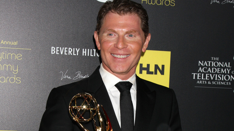 Bobby Flay smiling with Daytime Emmy 