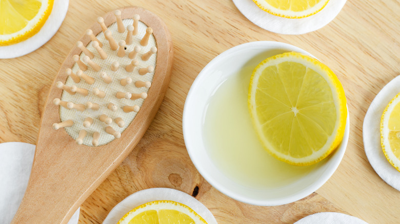 lemon in water with a hairbrush