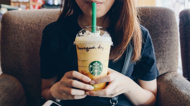Woman enjoying a Starbucks Frappuccino