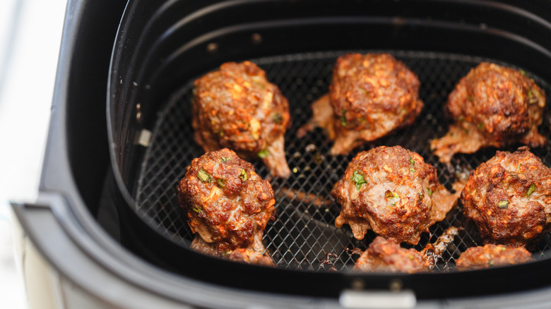 Meatballs in an air fryer basket