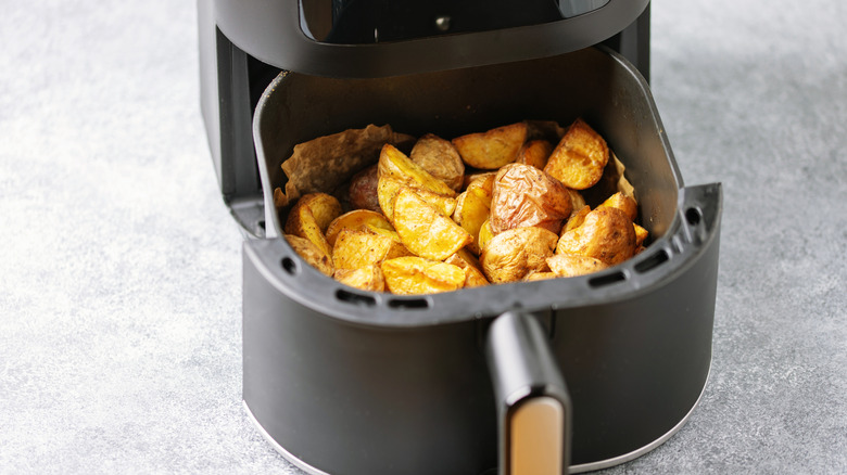 Roasted potatoes in an air fryer basket