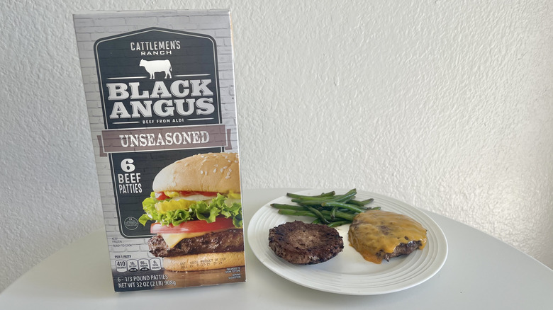 Two Cattlemen's Ranch Unseasoned Black Angus Beef Burger Patties on a small plate