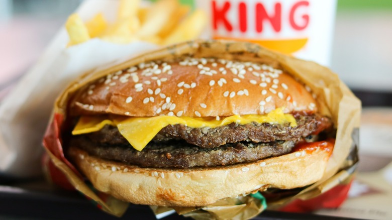 A meal at Burger King with a double burger, fries, and beverage.