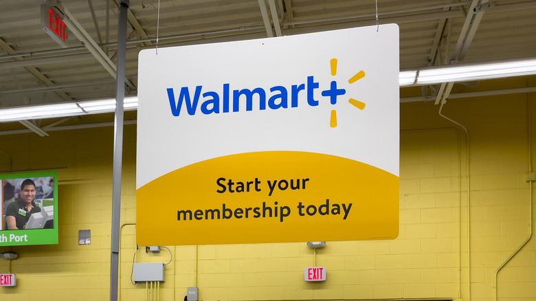 Walmart+ signage in store.