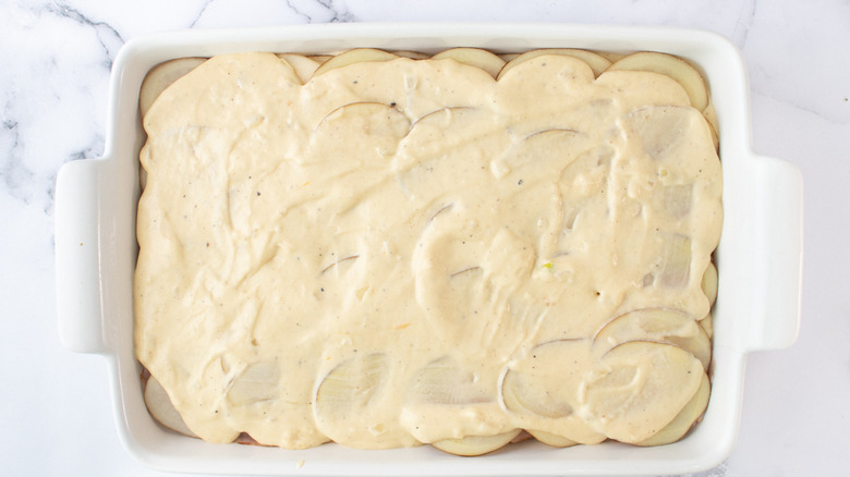 potatoes in pan with sauce