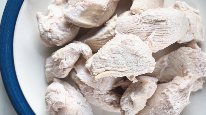 Pale, cooked chicken breasts