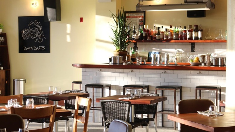 Light-filled bar with tables