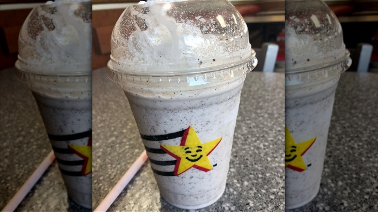 A Carl's Jr. cookies and cream shake with straw