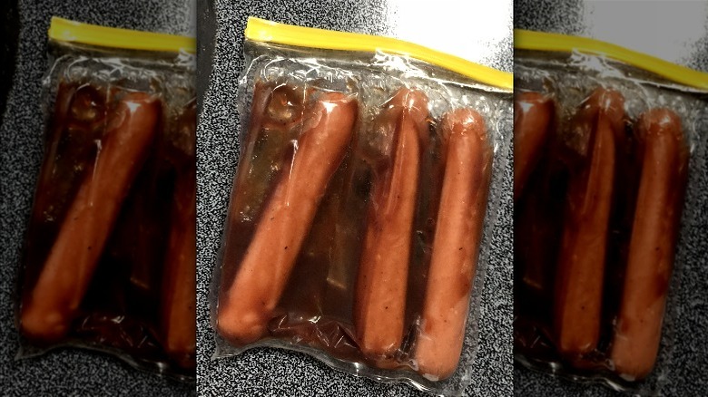 Hot dogs marinating in a plastic bag