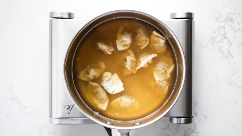 yellow liquid with dumplings