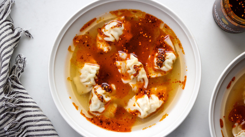 dumpling soup in white bowl