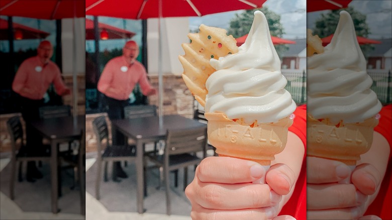 Hand holding vanilla ice cream cone topped with a waffle fry.