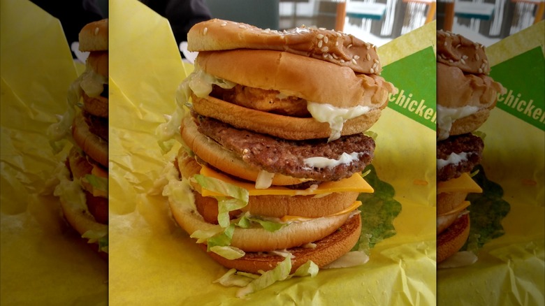 McDonald's Land, Air, & Sea sandwich on yellow wrapper.