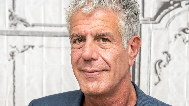 Anthony Bourdain smiling at publicity event.