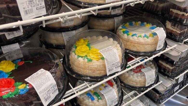 Multiple varieties of cake on display at Costco.