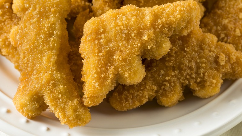 dinosaur chicken nuggets on plate