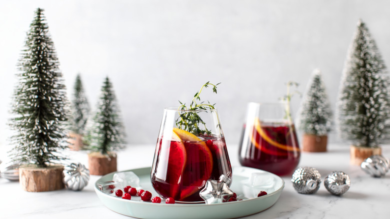 Christmas decorations with red drinks in glasses