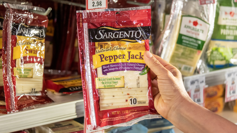 hand holding Sargento cheese