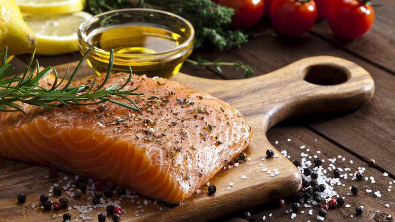 Raw salmon on cutting board