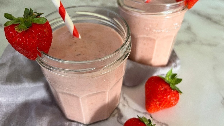 pink smoothies with strawberry garnish