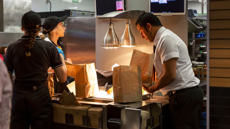 mcdonald's staff working on food orders in the kitchen