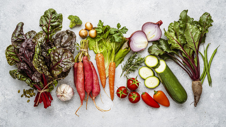 Fresh vegetables laid out on grey countertop