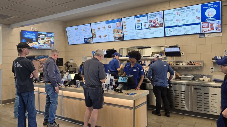 Customers ordering food at a Culver's counter