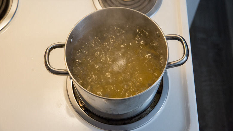 pasta cooking in medium pot