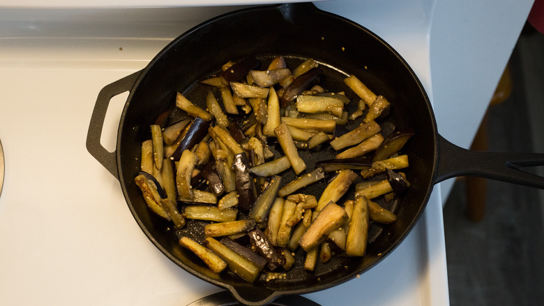 cooked eggplant in iron pan