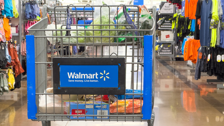 Walmart shopping cart in the middle of a store aisle